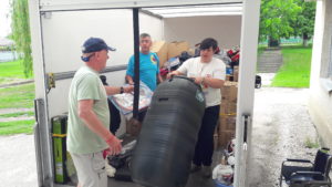 Volunteers unloading a CWUHA truck